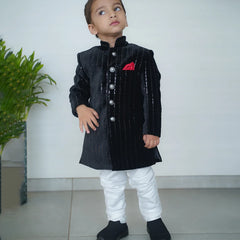 wedding wear black color achkan with white pajama.