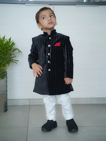 wedding wear black color achkan with white pajama.