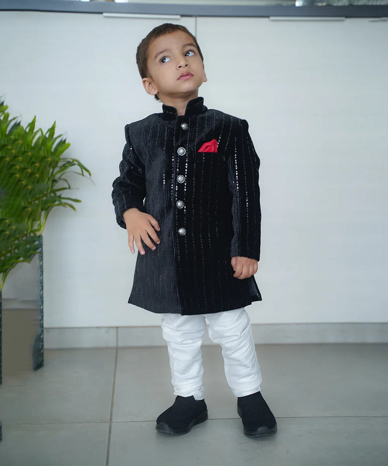 wedding wear black color achkan with white pajama.