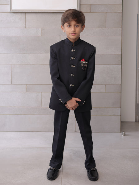  It is a black Jodhpuri suit set which consists of a Jodhpuri Coat along with matching pants. It features stylized buttons, a red coloured pocket square and a nice broach.