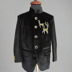 Black velvet suit jacket with gold deer emblem on a mannequin against a beige background