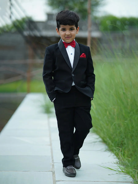 An elegant Suit set that comes with a black coat, white shirt and black pants perfect for every formal occasion. This top-line quality suit set is paired with a beautiful red Colored bow and a pocket square.