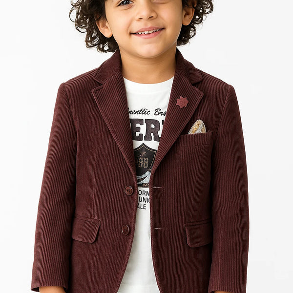 Child wearing a brown corduroy blazer over a graphic t-shirt on a white background