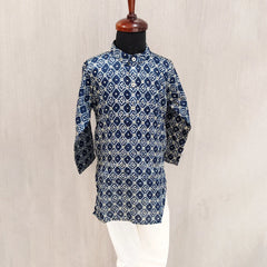 Blue patterned kurta on a mannequin against a beige background