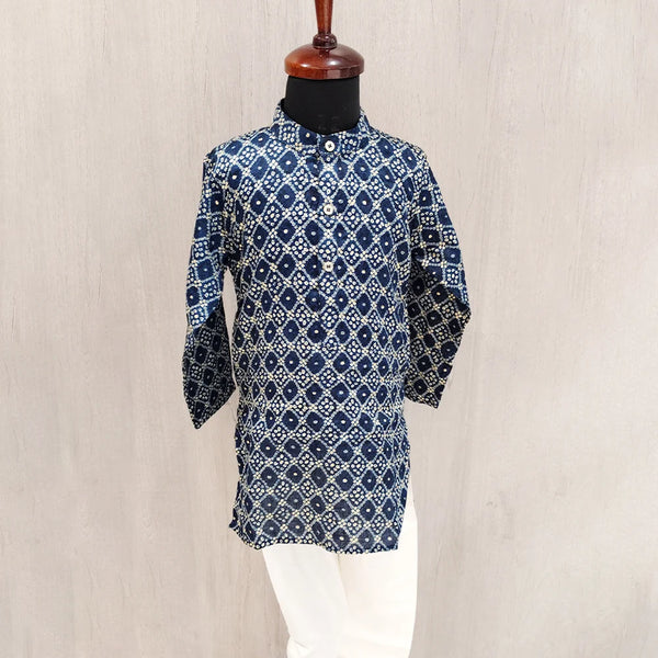 Blue patterned kurta on a mannequin against a beige background