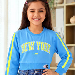 Girls' blue New York print full sleeve crop top, front view, by Devils N Angels Jaipur
