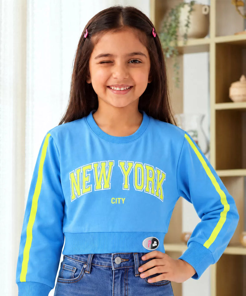 Girls' blue New York print full sleeve crop top, front view, by Devils N Angels Jaipur