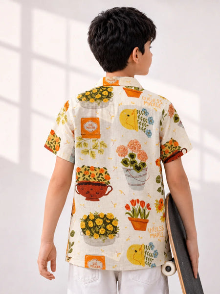 Person wearing a colorful floral shirt with a skateboard, standing against a white background