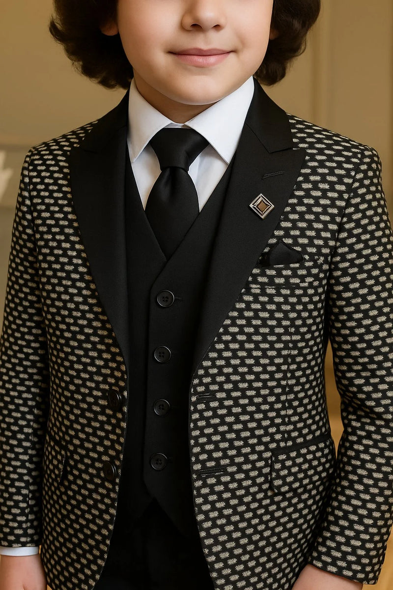 Child wearing a patterned suit with a tie and pocket square.