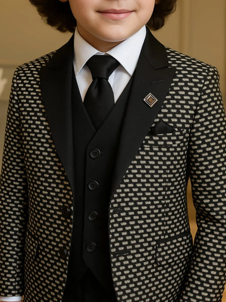 Child wearing a patterned suit with a tie and pocket square.