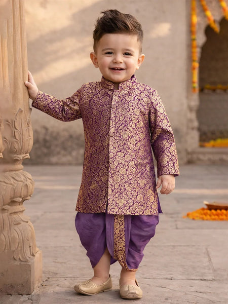 Child wearing a traditional outfit standing outdoors near architectural elements.