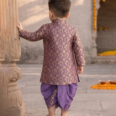 Child in traditional outfit standing in a temple setting