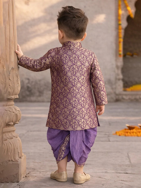 Child in traditional outfit standing in a temple setting