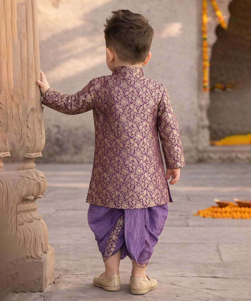 Child in traditional outfit standing in a temple setting