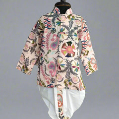 A boy's kurta set with a white dhoti and multicolor print, displayed on a mannequin.