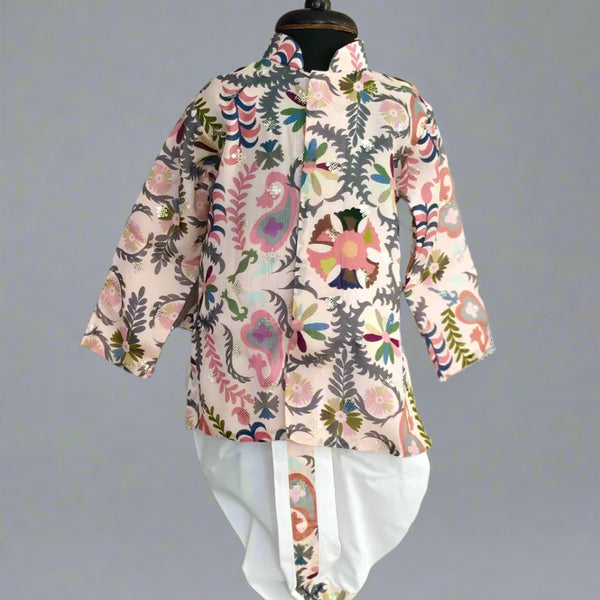 A boy's kurta set with a white dhoti and multicolor print, displayed on a mannequin.