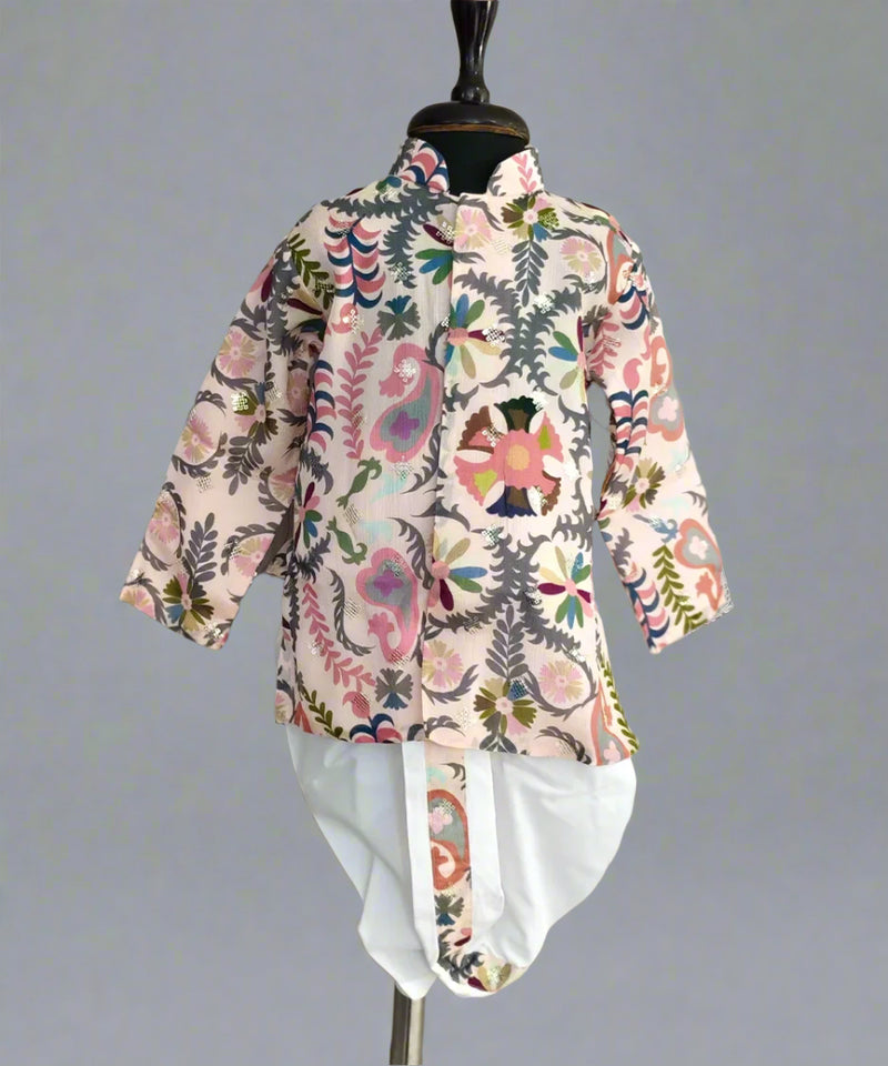 A boy's kurta set with a white dhoti and multicolor print, displayed on a mannequin.