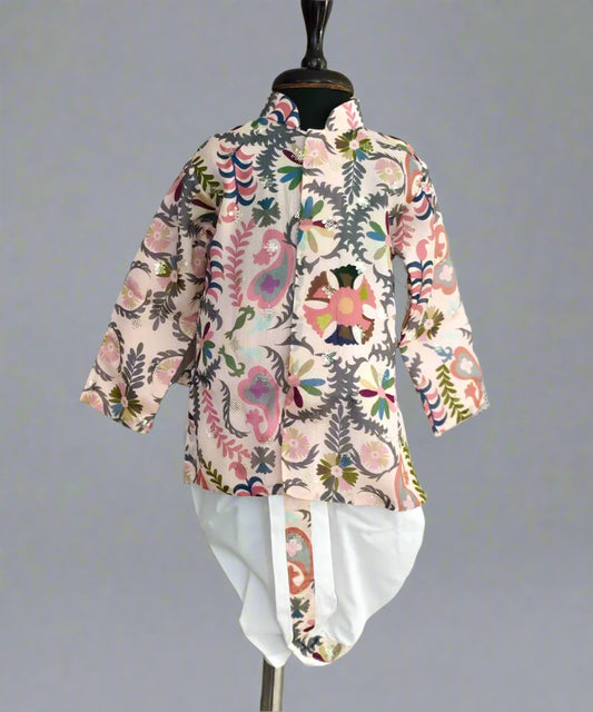 A boy's kurta set with a white dhoti and multicolor print, displayed on a mannequin.