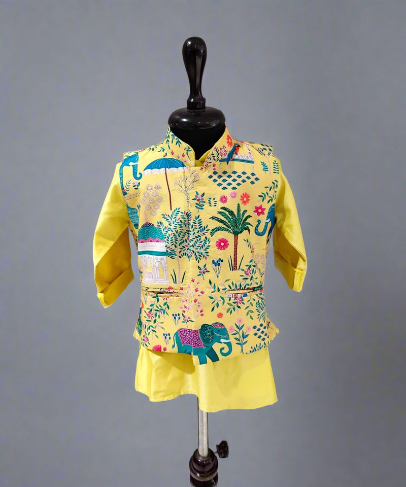 A yellow kurta pyjama jacket set for kids with a printed design, displayed on a mannequin.