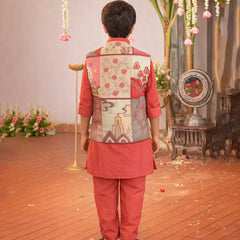 Person wearing a traditional outfit with a floral vest in an indoor setting with decorative elements.