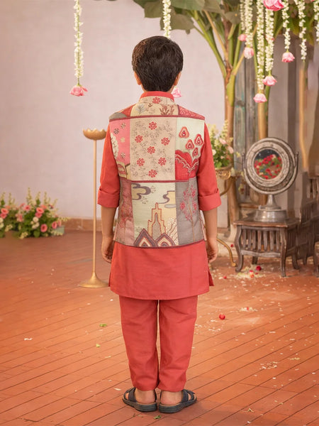 Person wearing a traditional outfit with a floral vest in an indoor setting with decorative elements.
