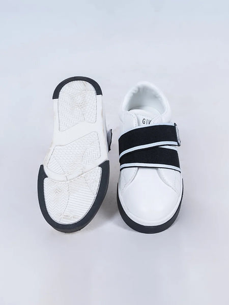 Close-up of trendy boys' white sneakers with black bands and easy-fit design, Jaipur