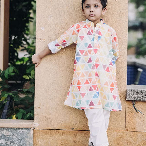It is a multi colored printed kurta teamed up with a matching pyjama, that can be creatively styled with ethnic shoes and is the best boy's designer kurta-pyjama set.