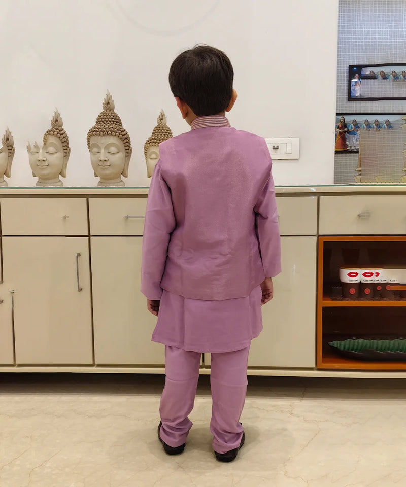 The is back look of lavender color kurta pajama with jacket. The jacket is plain from behind.