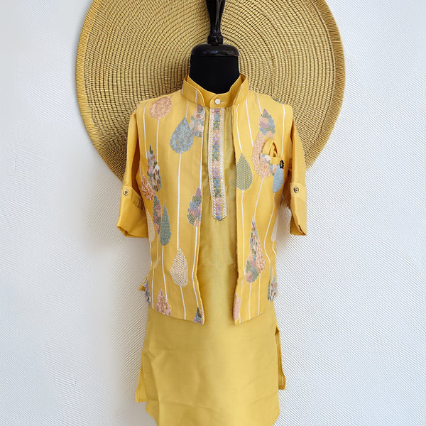 Yellow outfit with floral patterns on a mannequin against a white background