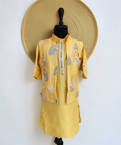 Yellow outfit with floral patterns on a mannequin against a white background