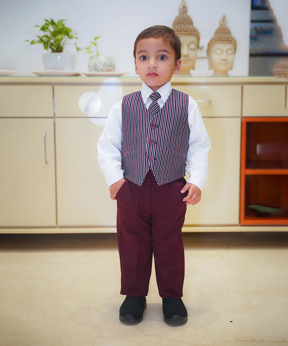 The picture shows the boy without the blazer and wearing just the striped waist coat with white shirt and maroon pant