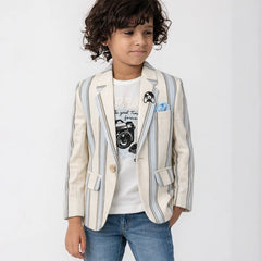 Child wearing a striped blazer over a graphic t-shirt with jeans on a white background