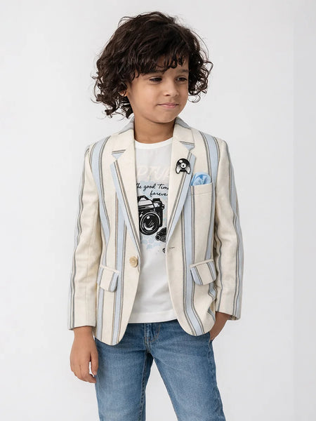 Child wearing a striped blazer over a graphic t-shirt with jeans on a white background