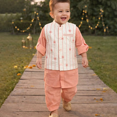 Child in traditional outfit walking on a wooden path with decorative lights in the background