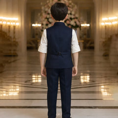 Person wearing a formal outfit in an elegant indoor setting with chandeliers.