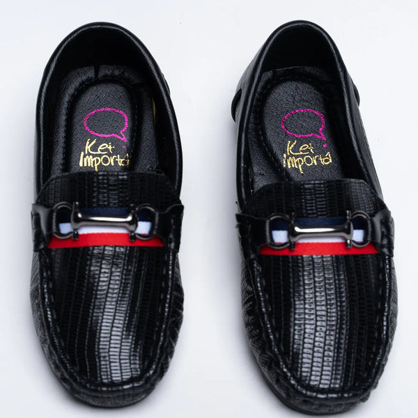 Boys' trendy black moccasins featuring embossed pattern, buckle, and red sole, Jaipur