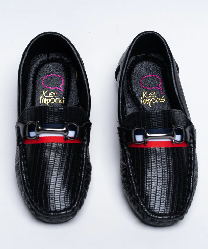 Boys' trendy black moccasins featuring embossed pattern, buckle, and red sole, Jaipur
