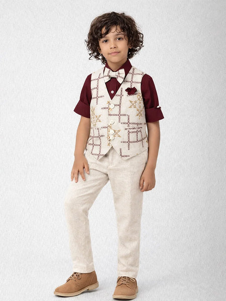 Child wearing a formal outfit with a vest, shirt, and pants on a light gray background