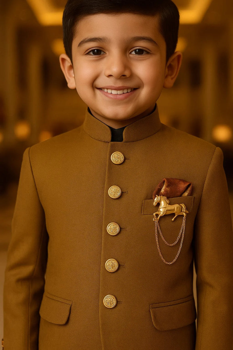 Young boy wearing a brown traditional outfit with gold buttons and a decorative patch.