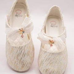Infant girls’ ivory glitter party shoes with organza bow and floral embellishment, Jaipur

