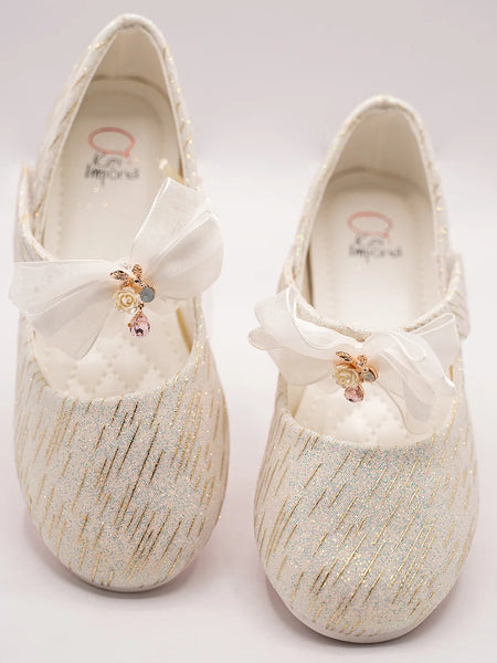 Infant girls’ ivory glitter party shoes with organza bow and floral embellishment, Jaipur

