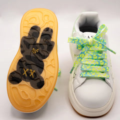 Close-up of trendy girls' sneakers with smile print and bold neon laces, perfect for playful outings in Jaipur

