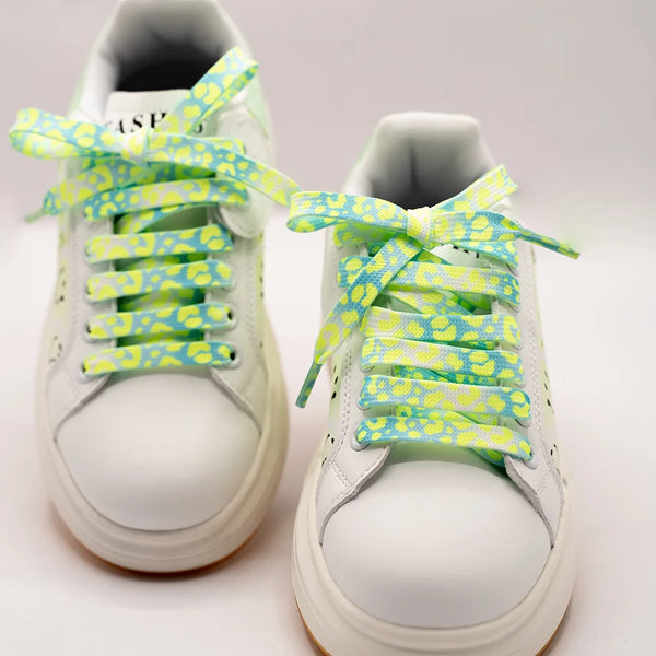 Kids' white lace-up shoes for girls featuring happy face graphics and bright neon accents, Jaipur