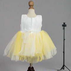 back view of white yellow frock for baby girls 