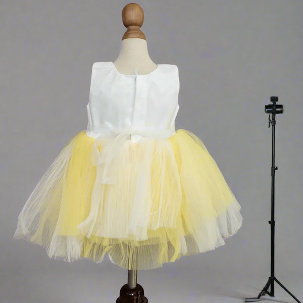 back view of white yellow frock for baby girls 