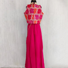 Mannequin wearing a red and pink traditional outfit with a white background