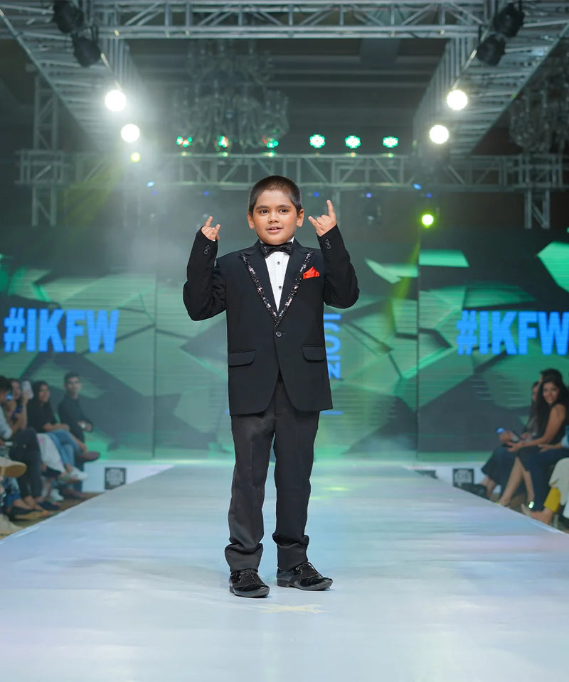Elegant sequin lapel boys tuxedo with red pocket square Jaipur