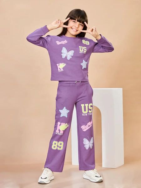 Child wearing a purple outfit with graphics on a beige background
