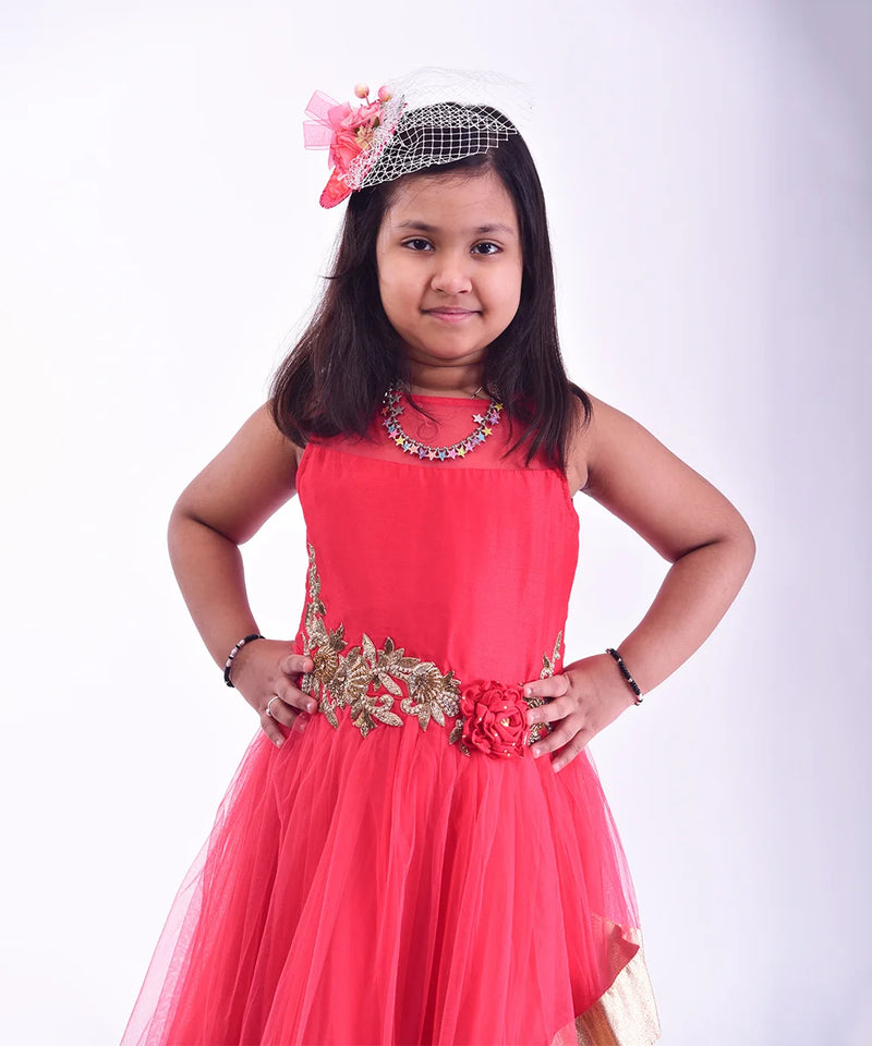  It is a red Colored double-layer party gown that comes with short sleeves that can be stitched as per requirement. It features floral embroidery detailing on the dress that uplifts the entire look.