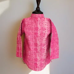 Pink textured shirt on a mannequin against a white background